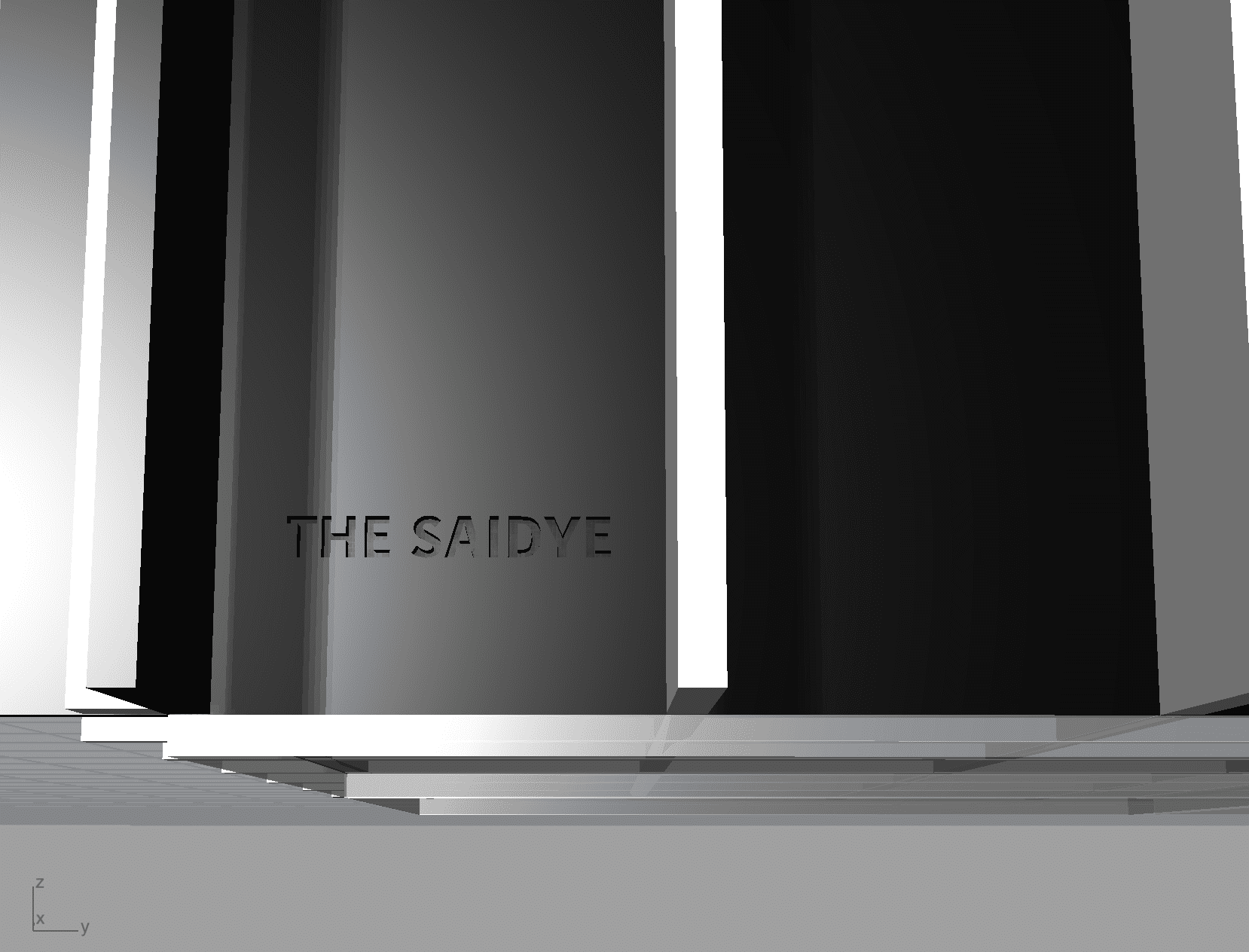 a white box with two black boxes inside, one with the text 'the saidye' engraved