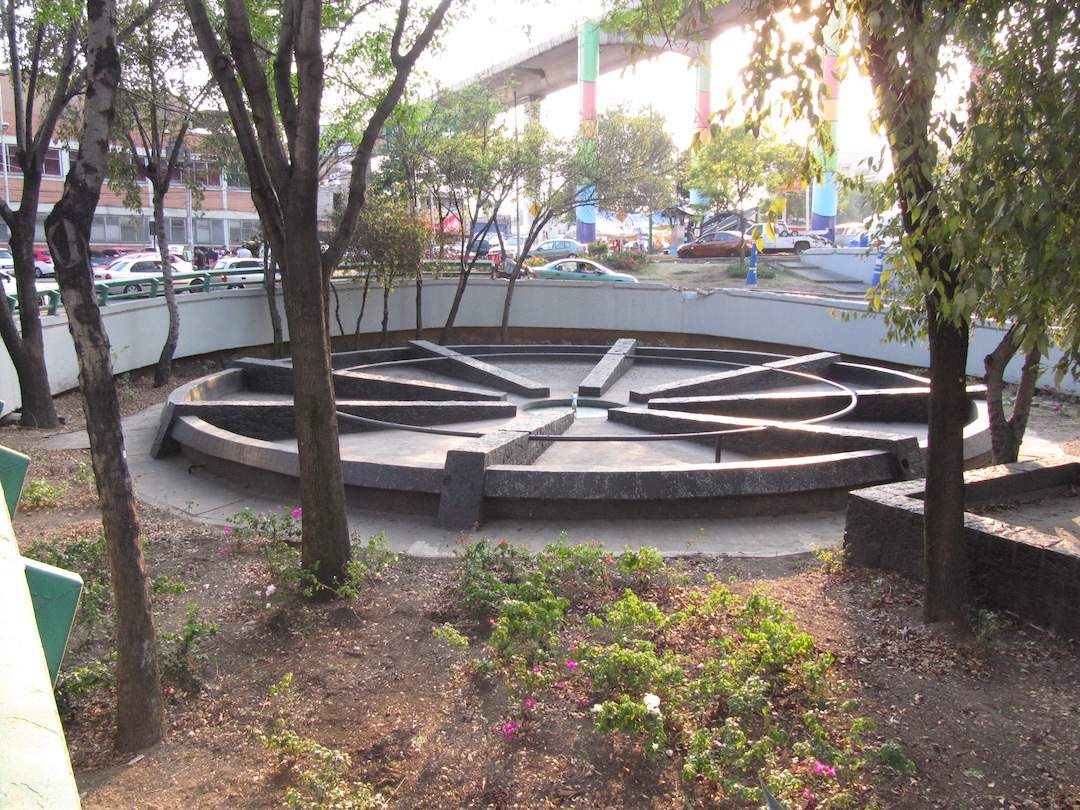 Google maps street view of a large flat wheel beside an overpass