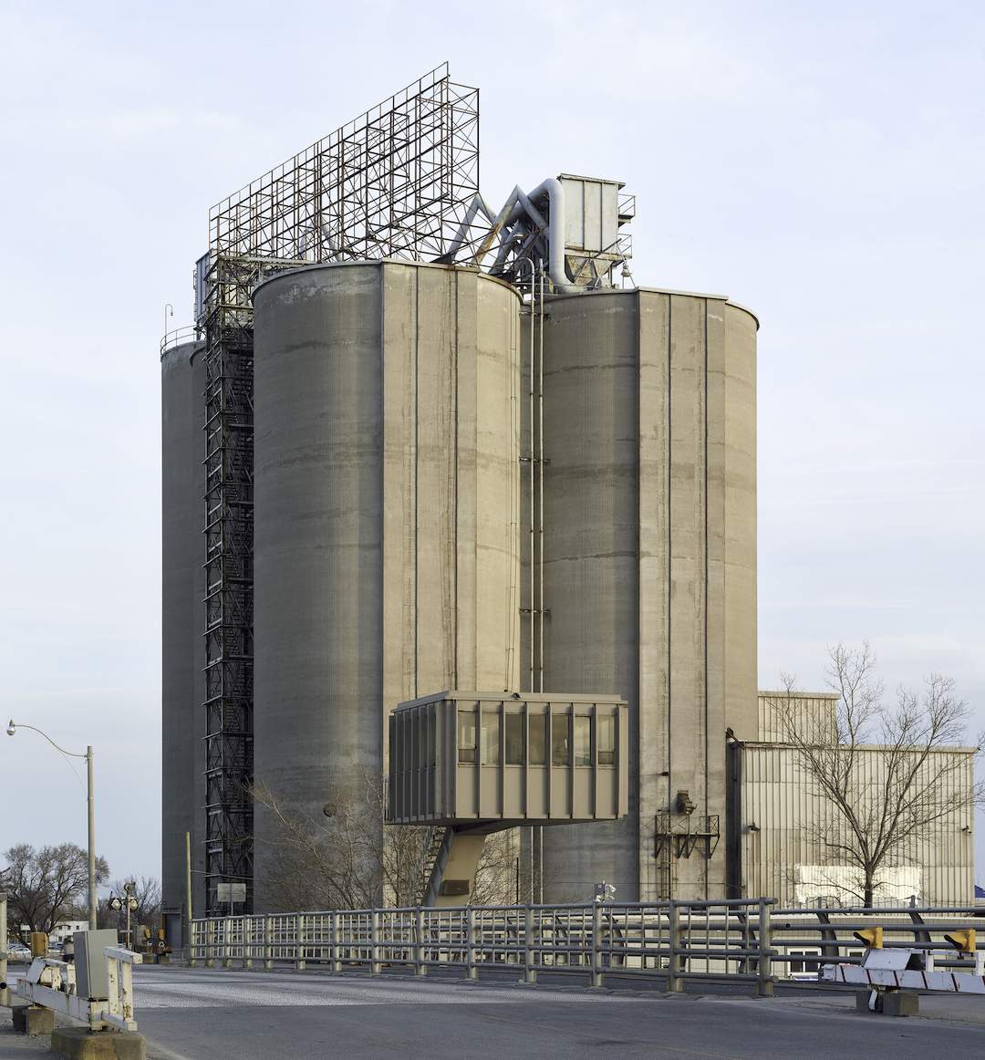 industrial towers behind a bridge